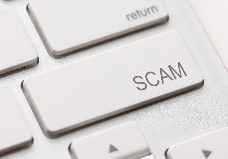 Enter key that says 'scam'