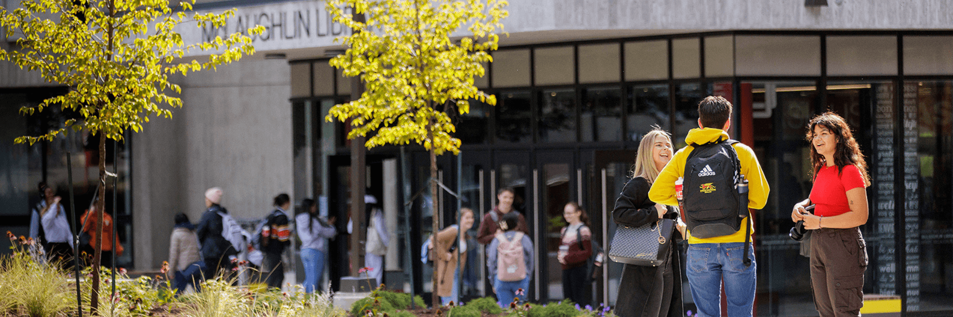 Students talking outside the McLaughlin Library