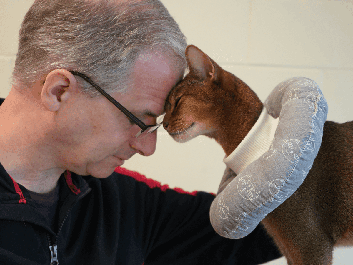 man and cat