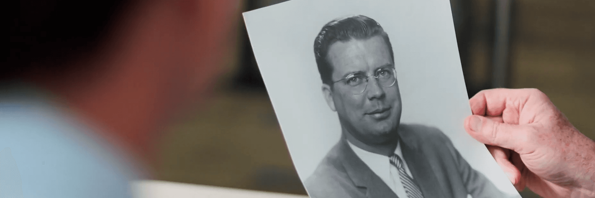 photo of a hand holding a photo of gordon s. lang