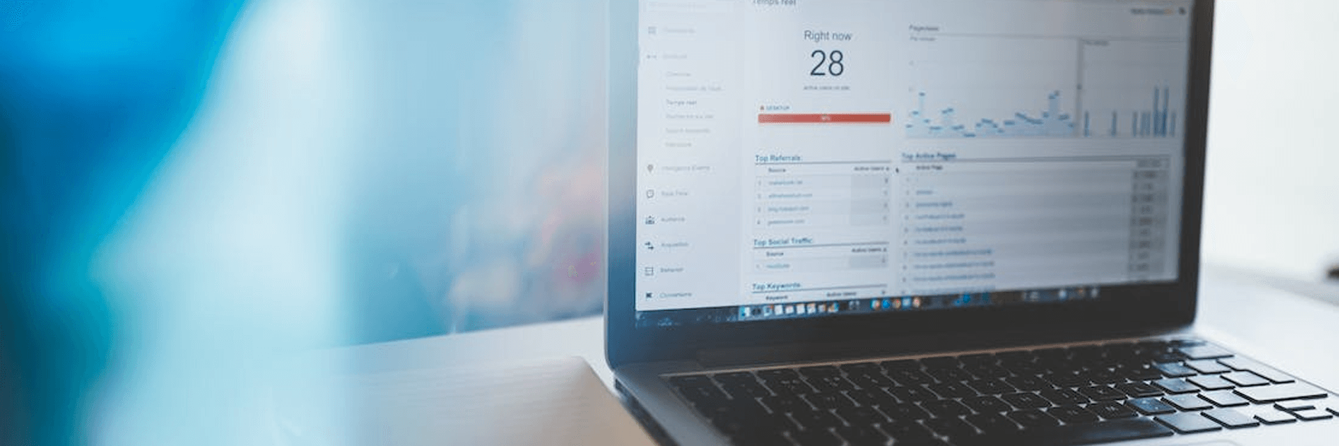 a photo of a laptop with analytics on the screen