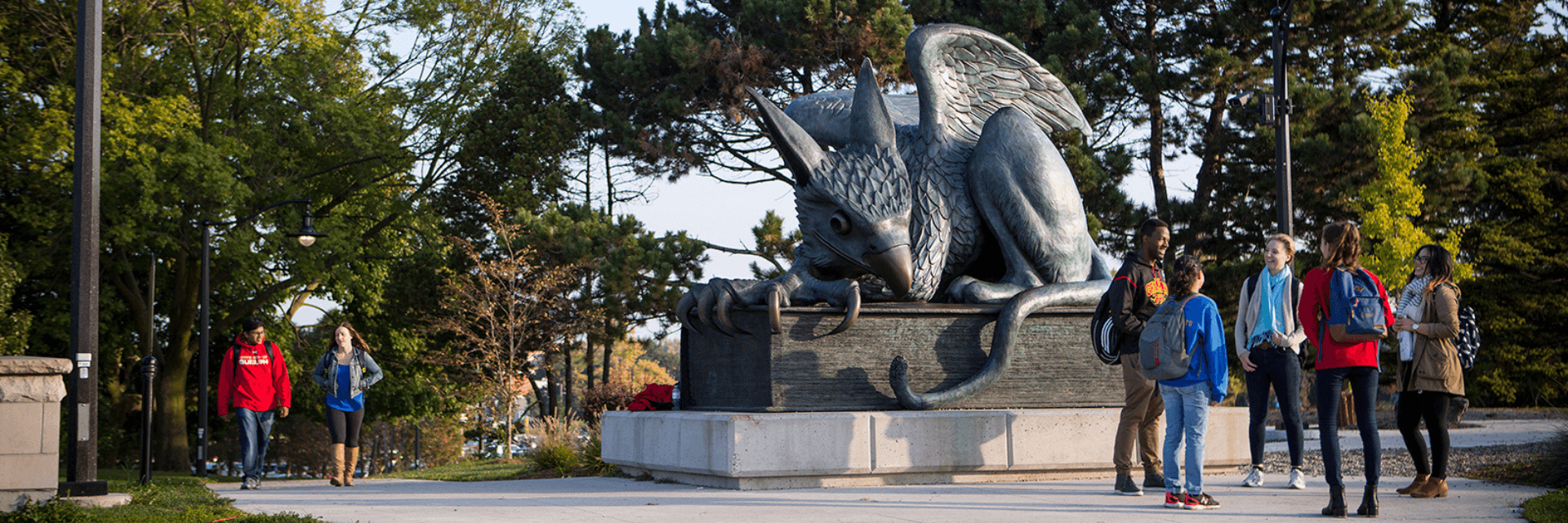 Students at the Gryphon Statue