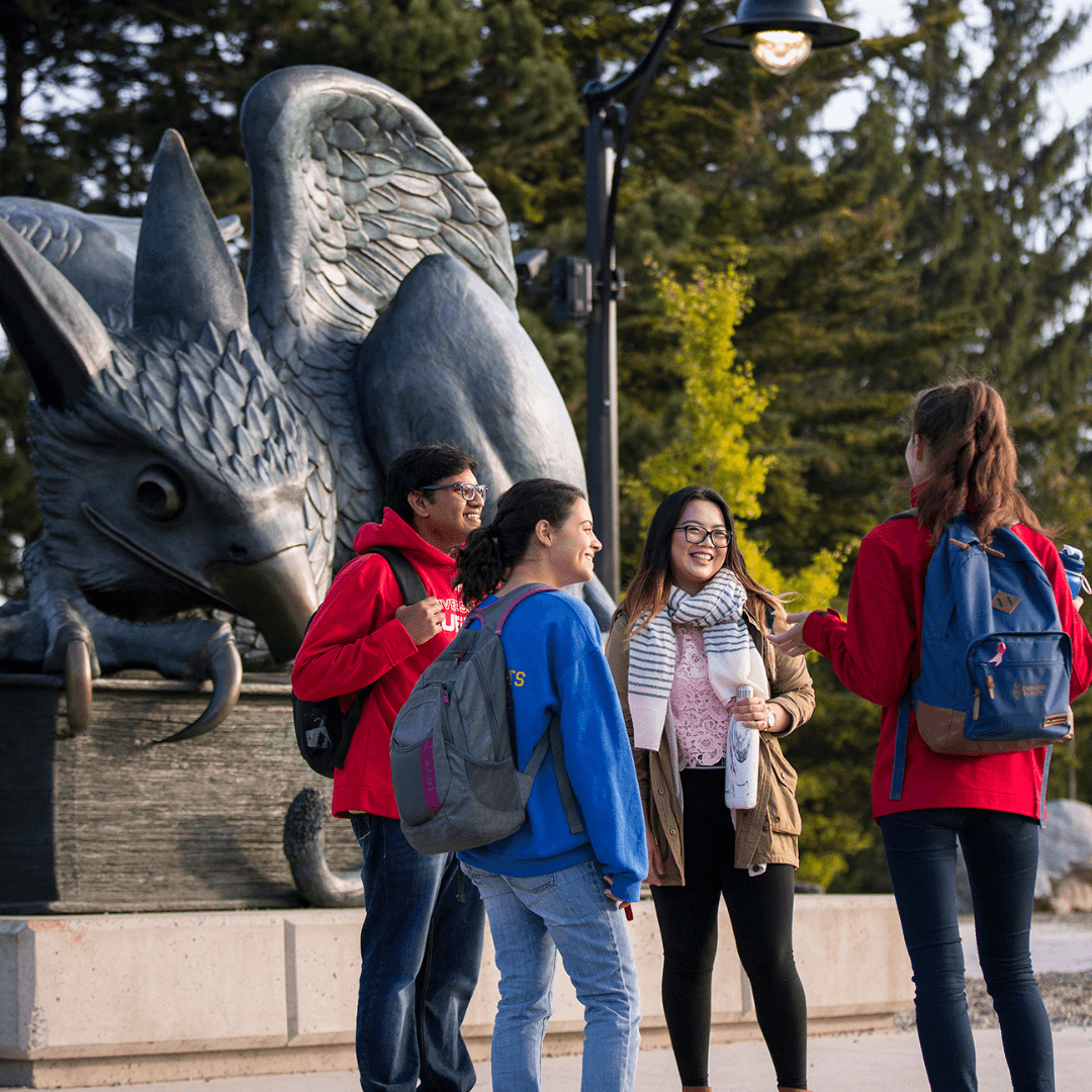 Students at the Gryphon Statue