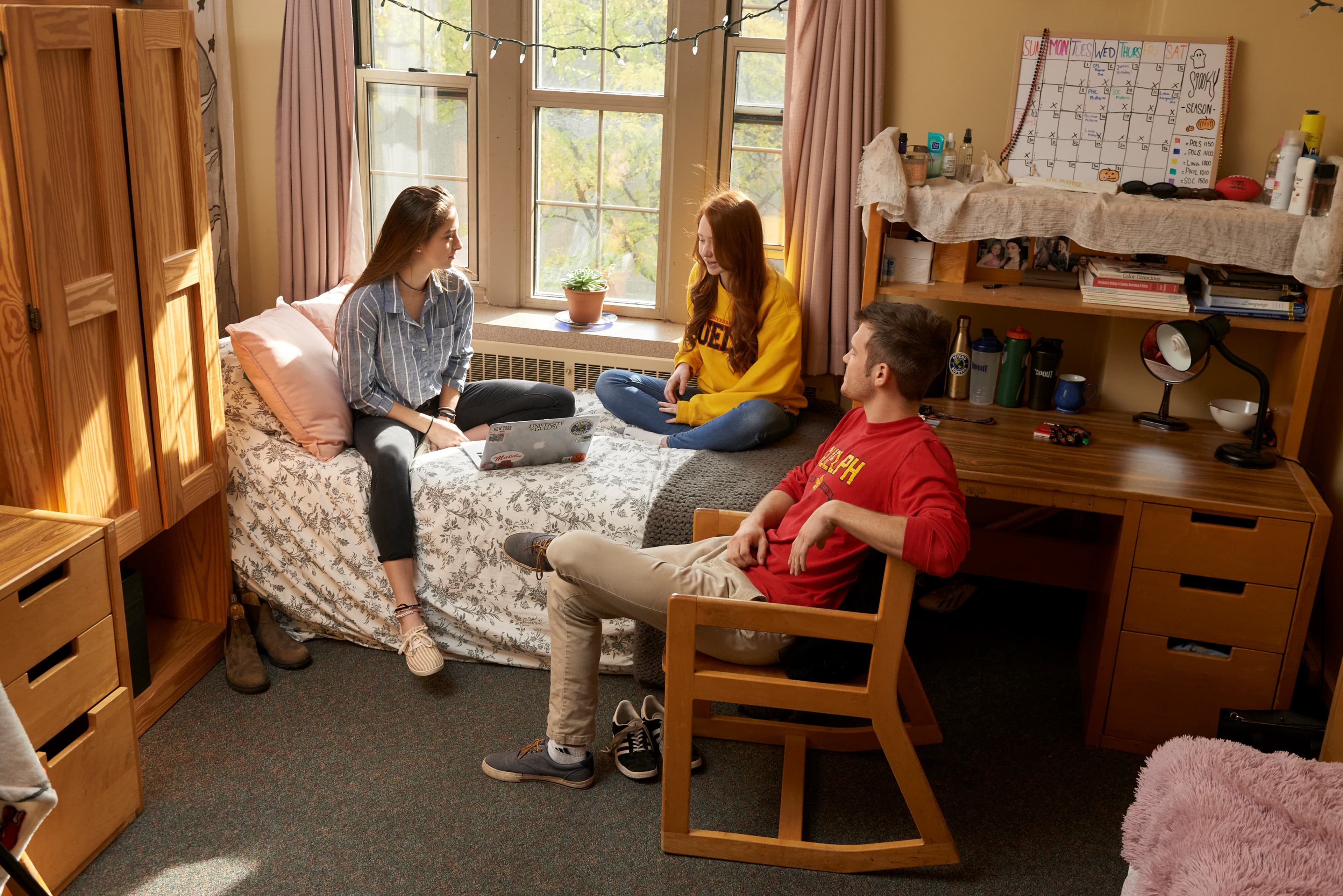 Students talking in a dorm room